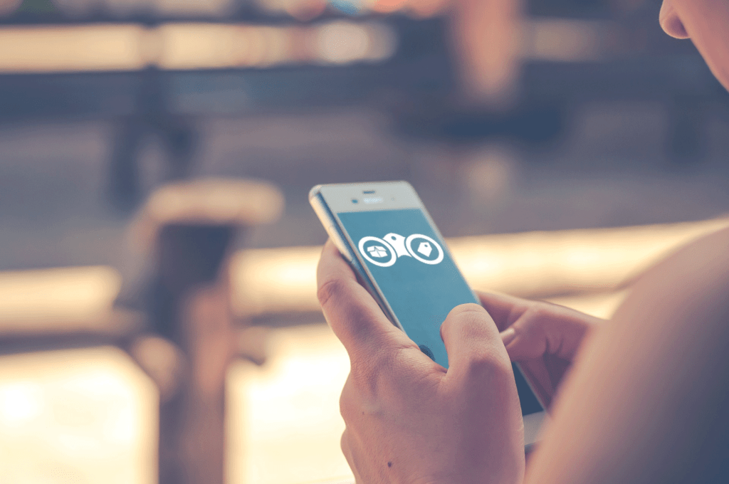 traista app logo user looking on phone Install Traista and find what you're looking for